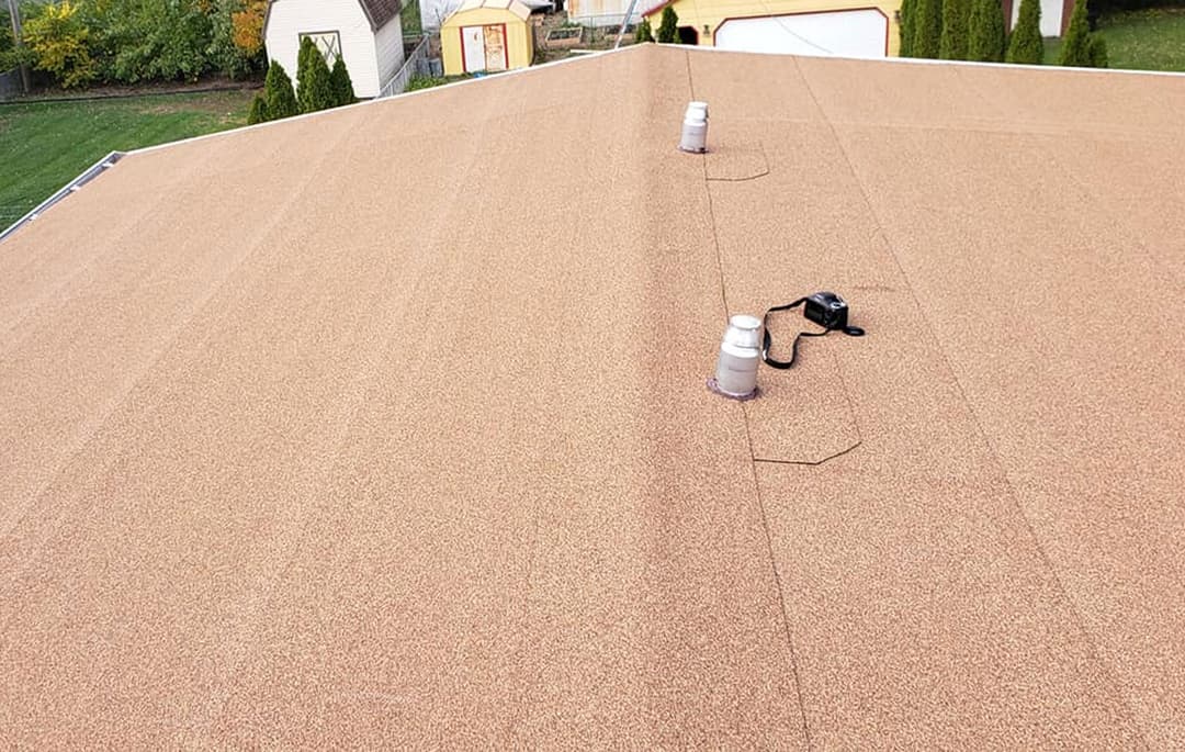 Roof replacement project with tools and materials onsite