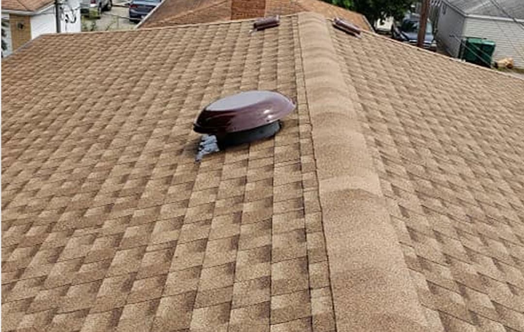 Completed shingle roof with ridge vent installed